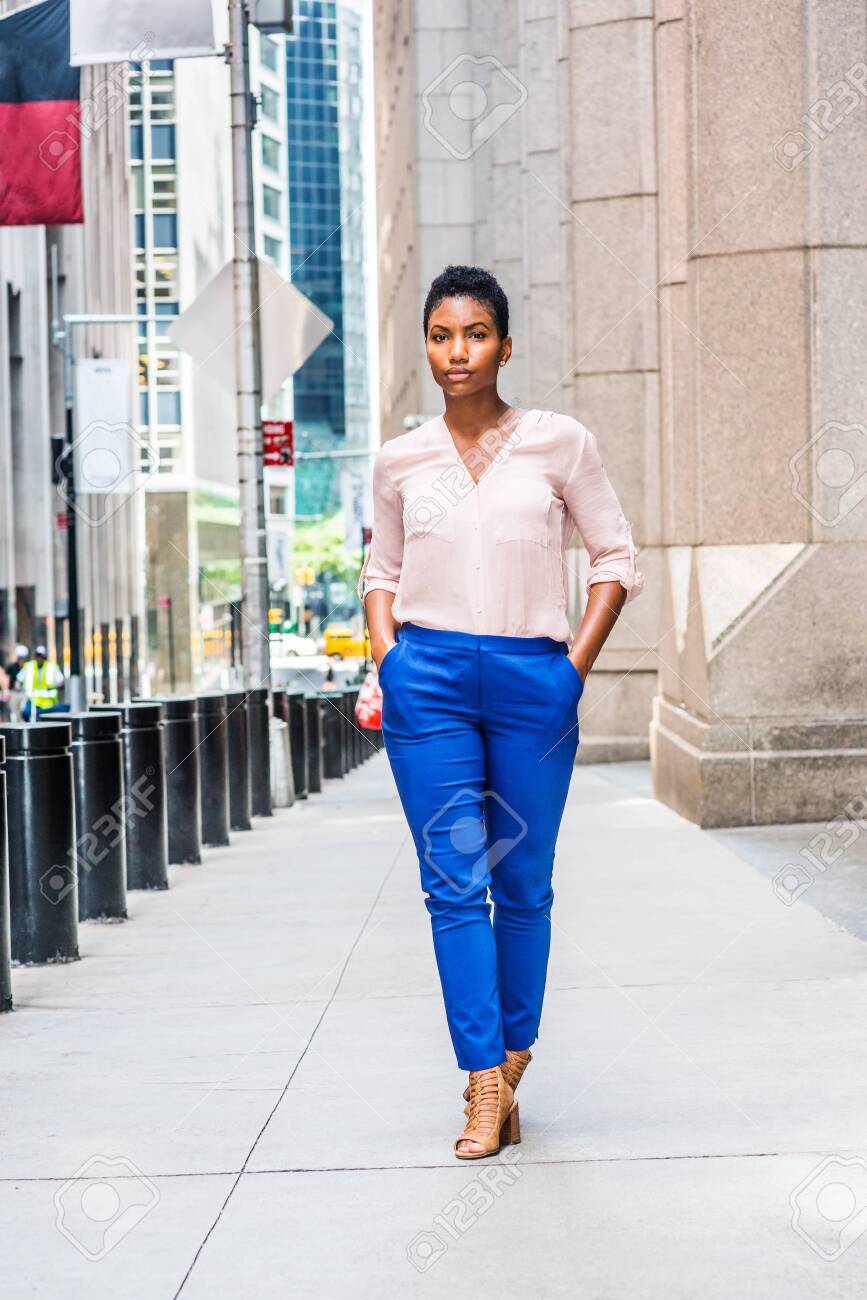 Young African American Woman With Short Afro Hair Traveling In New York City, Wearing Light Color What To Wear With Royal Blue Pants Female Young African American Woman With Short Afro Hair Traveling In New York City, Wearing Light Color What To Wear With Royal Blue Pants Female