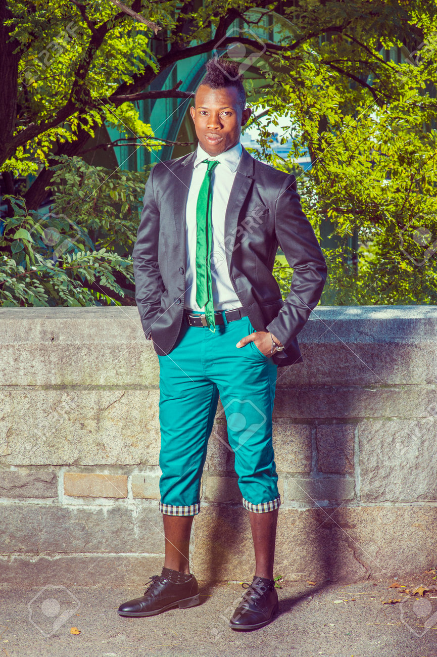 green shirt black pants white shoes