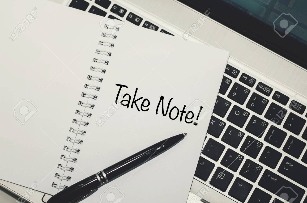 conceptual image word take note on white book over laptop background black another word for taking notes
