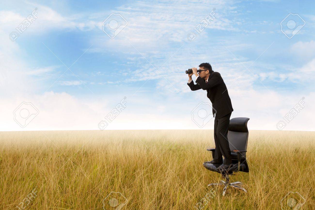 Business Man With Binoculars Looking To The Future Stock Photo Picture And Royalty Free Image Image
