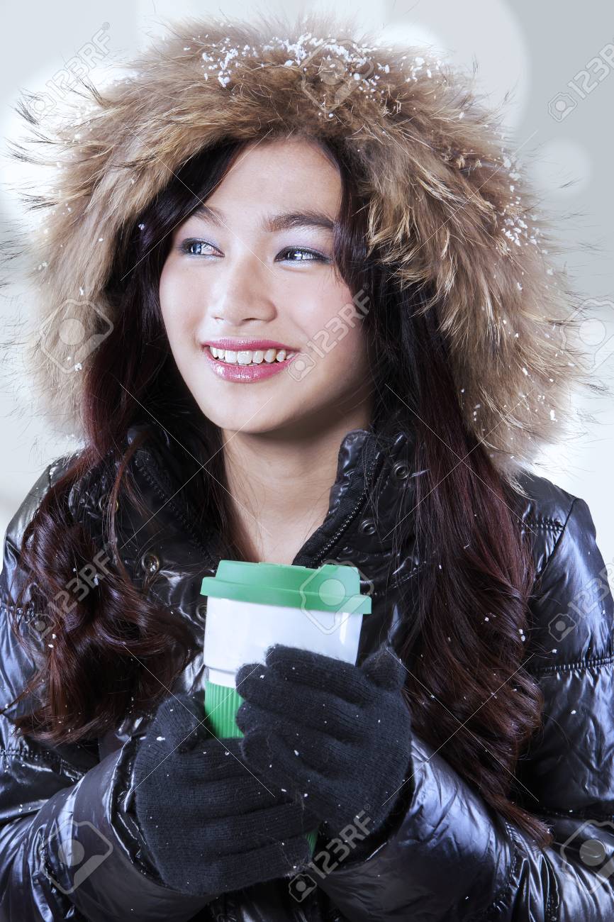 Gorgeous Teenage Girl In Winter Clothing And Holding A Hot Drink With Disposable Cup Stock Photo Gorgeous Teenage Girl In Winter Clothing And Holding A Hot Drink With Disposable Cup Stock Photo