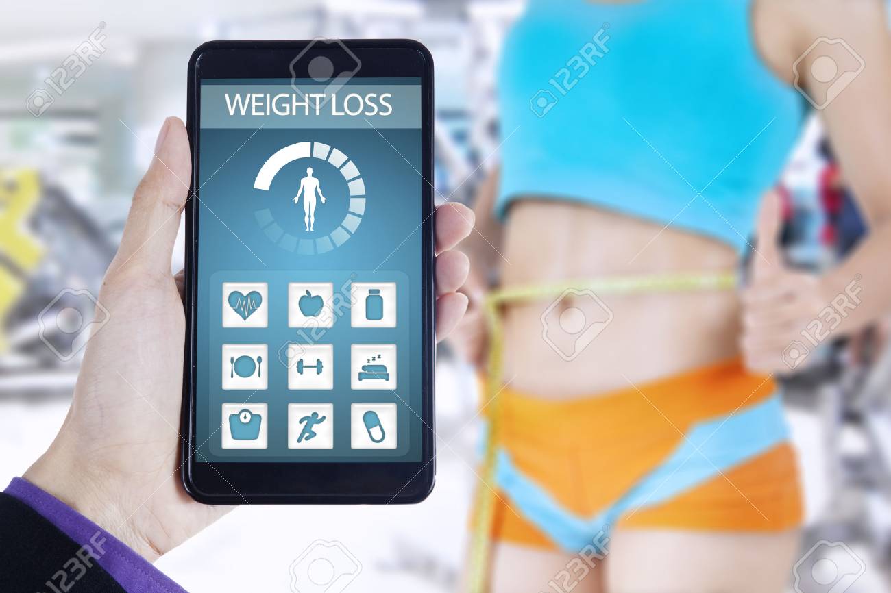 image of health monitoring app on the mobile phone shot with weight loss measurement app
