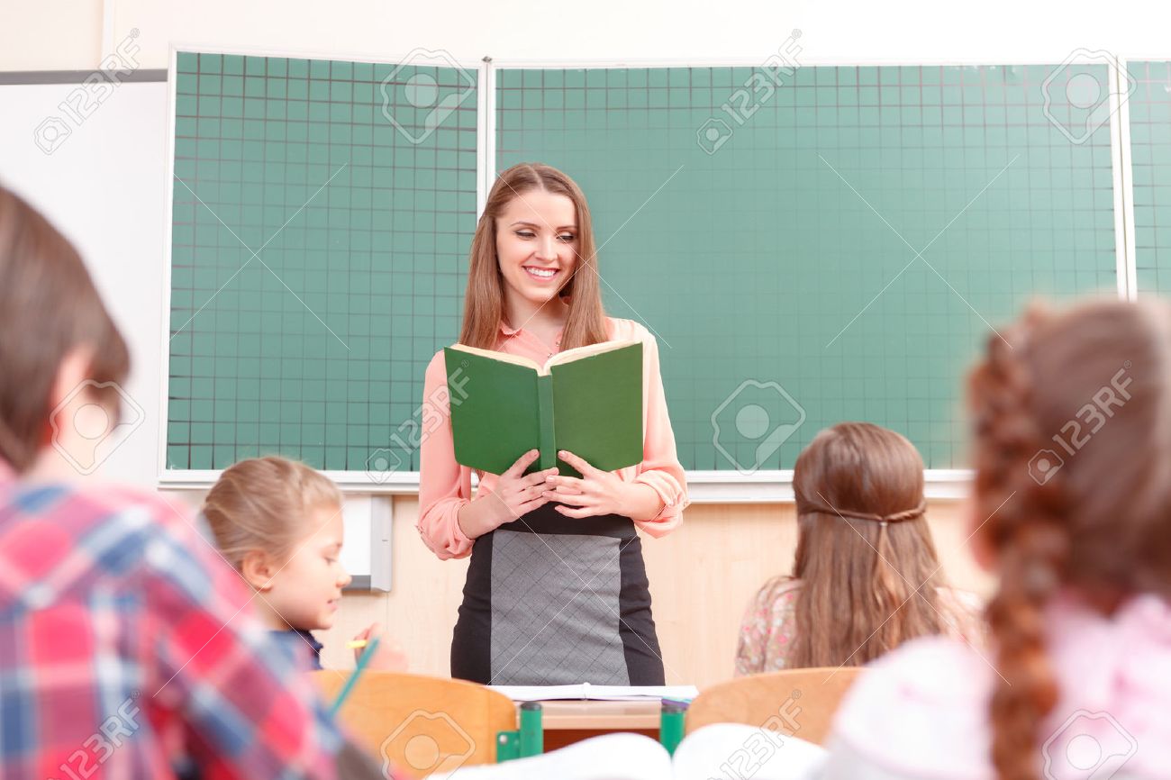Young Teacher. Young Pleasant Women Teaching At School In Junior.. Stock Photo, Picture And Royalty Free Image. Image 39511774.