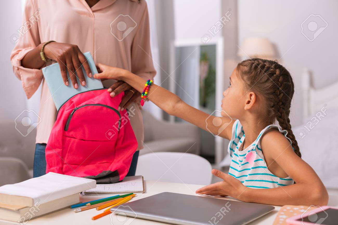 Time To Study Nice Smart Girl Taking A Copybook While Wanting Stock Photo Picture And Royalty Free Image Image 106744959