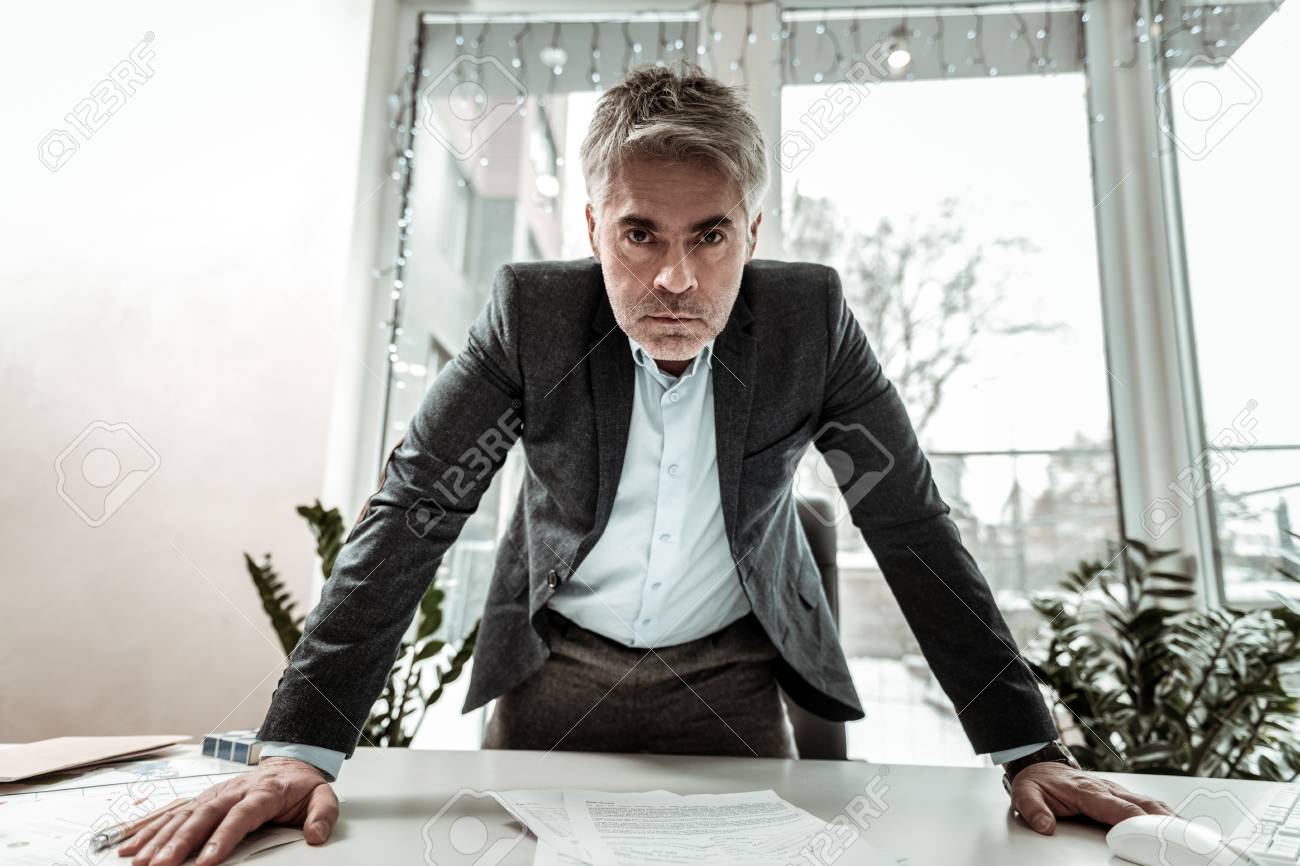 Bossy Man. Tall Grey-haired Adult Manager Wearing Eyeglasses Looking  Irritated Stock Photo, Picture and Royalty Free Image. Image 117284144., image size:1300x866