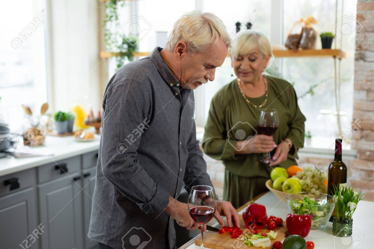 Man Cutting Veggies Cheerful Attractive Energetic Elderly Male