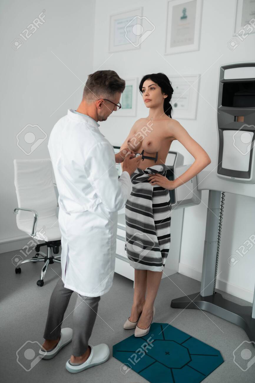 Slim Businesswoman With Naked Breast Having Examination Of Breast Stock  Photo, Picture and Royalty Free Image. Image 125860987.