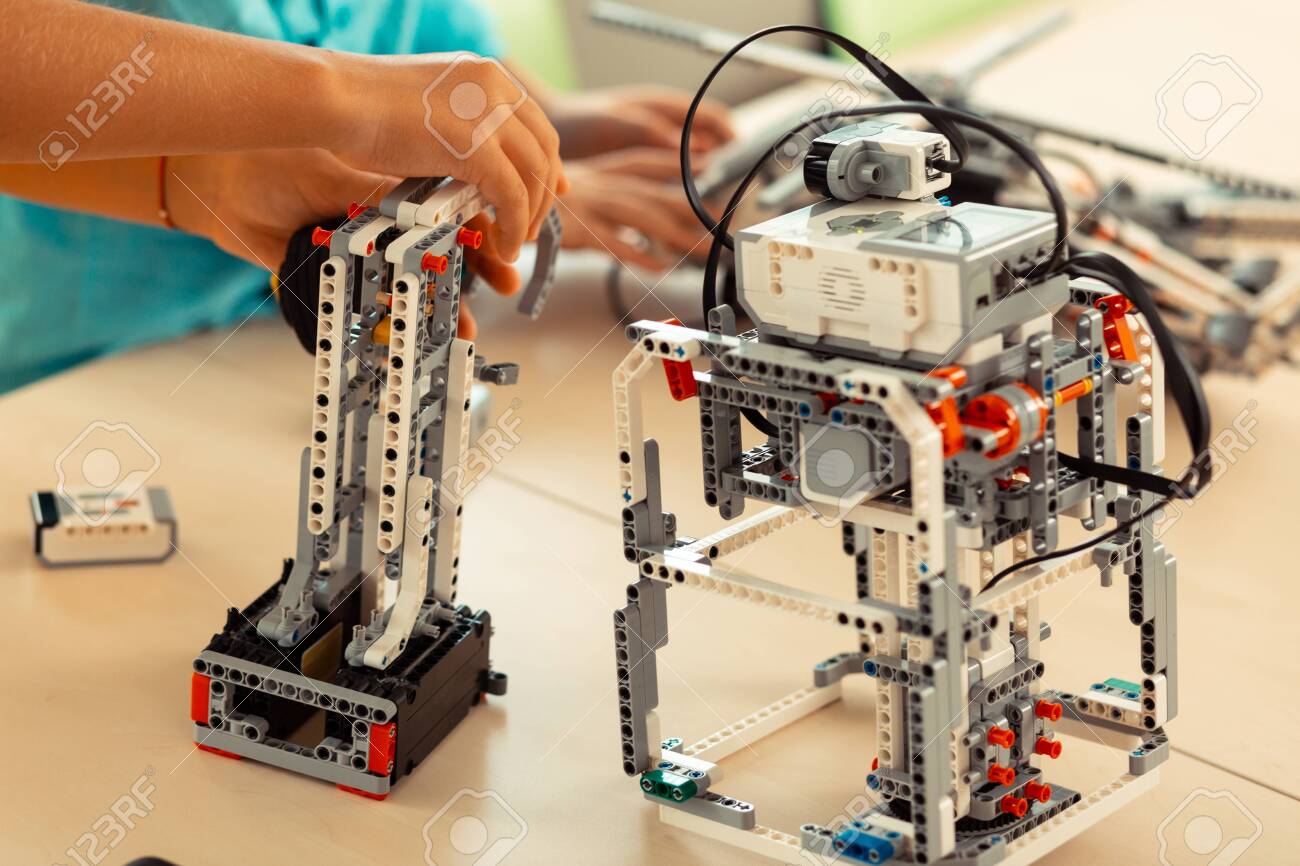 Young Robot Technicians Hands Of Pupils Making Robots Out Of - 