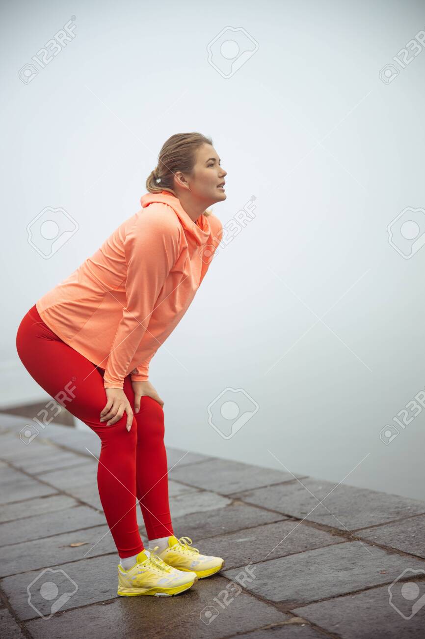 yaroslav astakhovYoung Woman In Sportswear Standing Bent