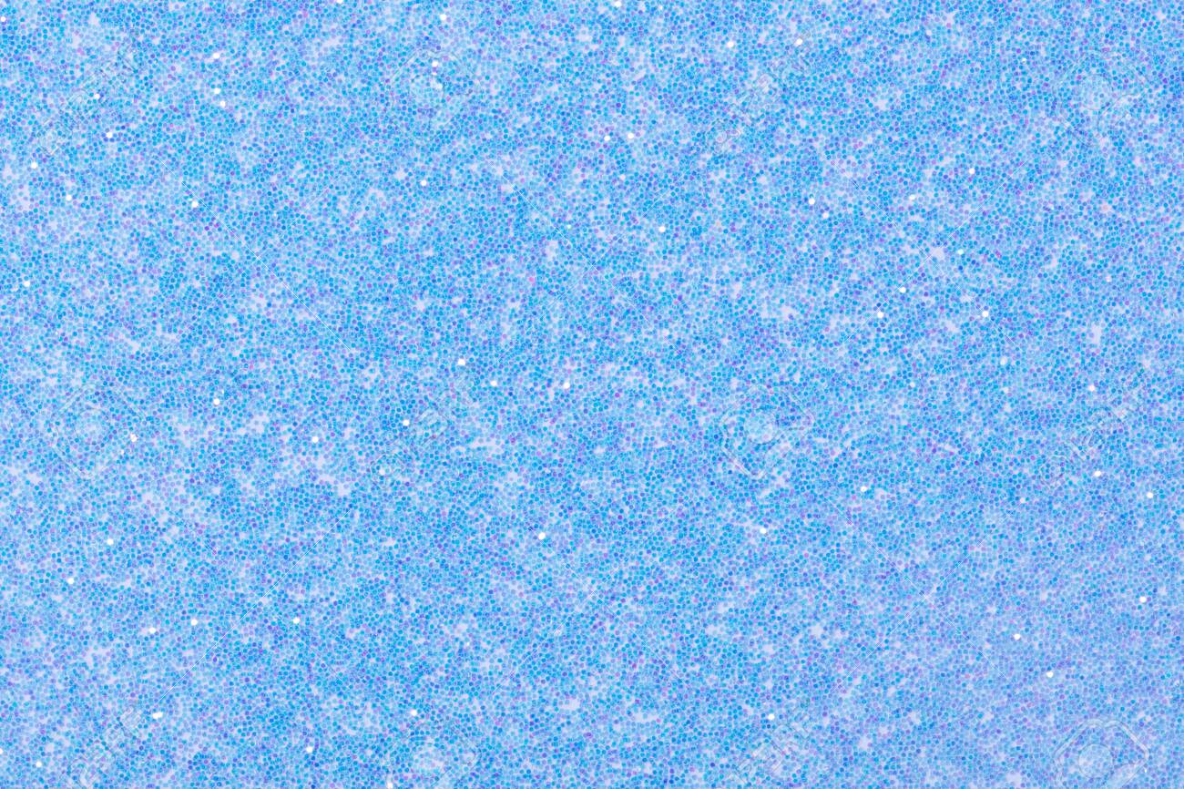 Holographic bright light blue glitter real texture background Stock Photo -  Alamy