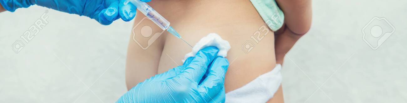 The Doctor Gives The Child An Injection In The Buttock Selective Focus People Stock Photo Picture And Royalty Free Image Image 142421977