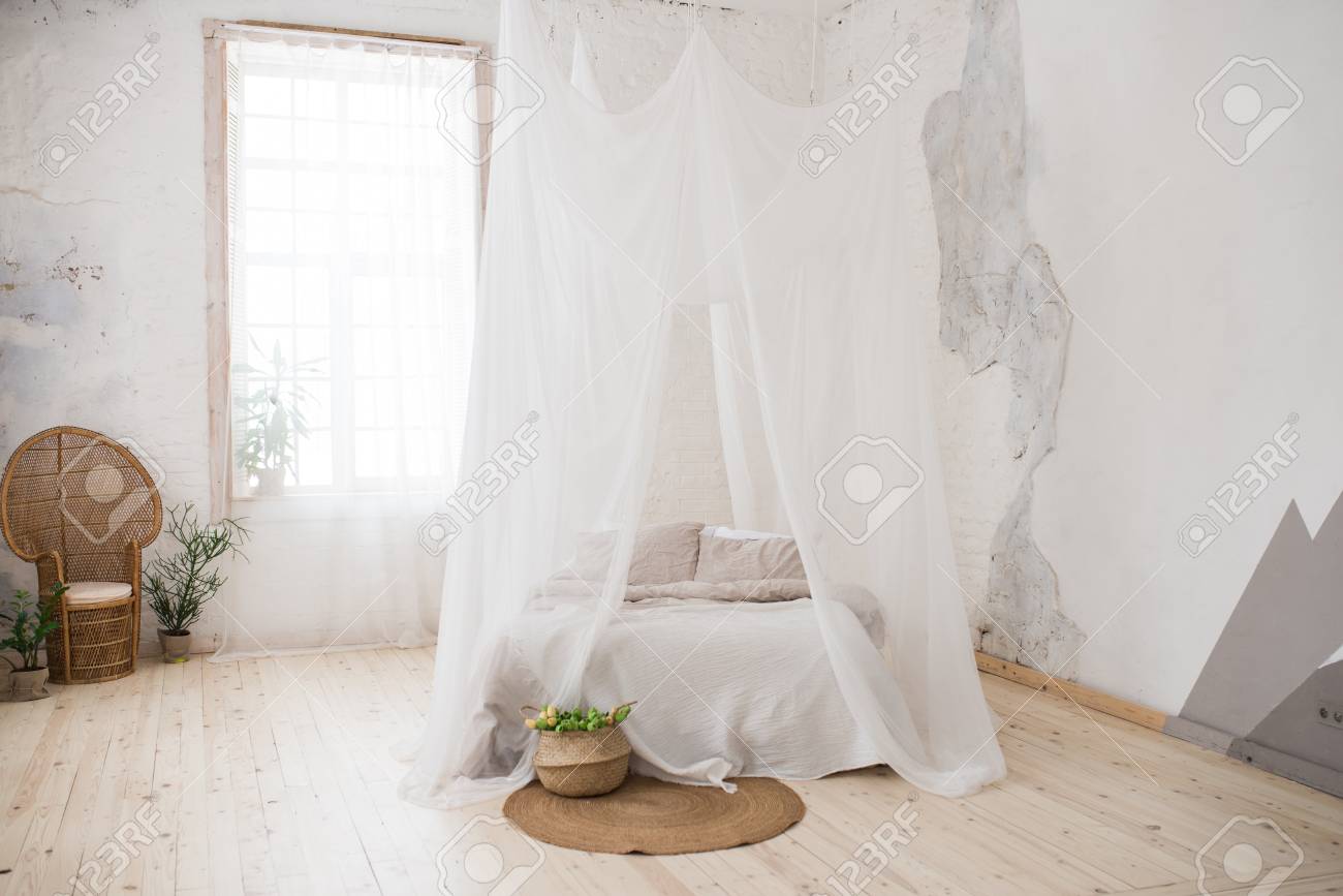Double Bed With Gray Bed Linen And Canopy. Bedroom. A Wicker - Double Bed With Gray Bed Linen And Canopy. Bedroom. A Wicker