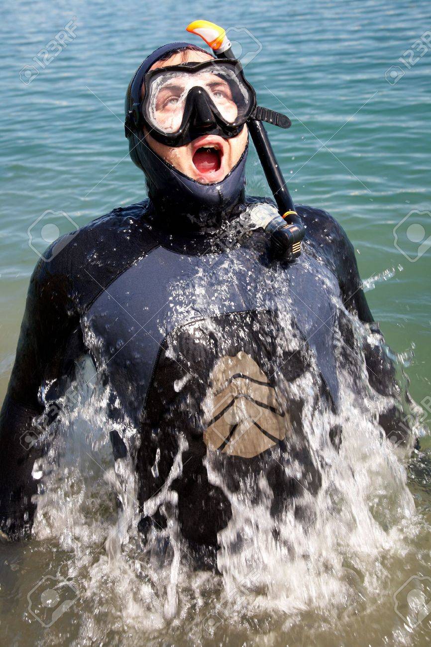 Diver In Diving Suit With Splashes Of Jumping Out Of Water And Gasping For Air Stock Photo Picture And Royalty Free Image Image 10572004