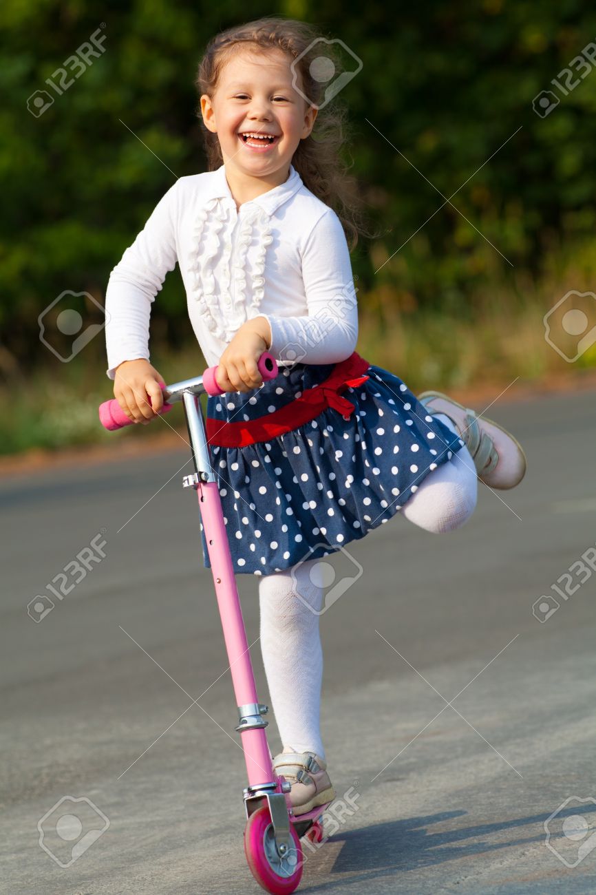 little girl on scooter