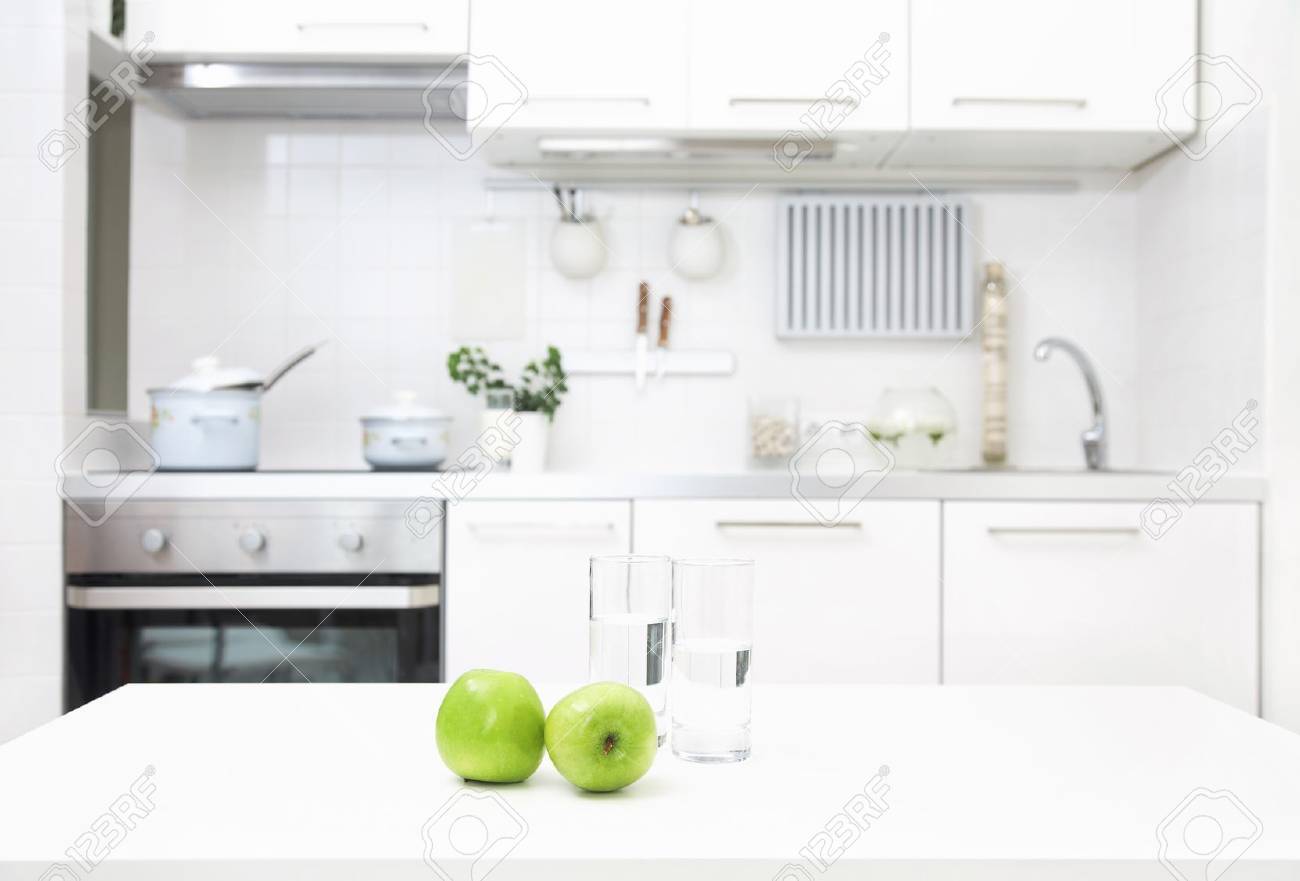 interior of small white kitchen with fresh apples on the table - 21504585 interior of small white kitchen with fresh apples on the table - 21504585