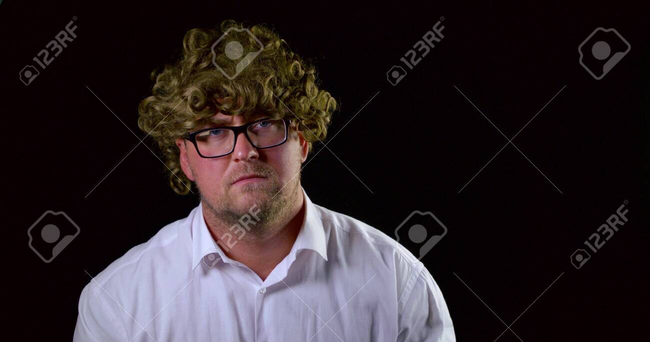 Sad Guy Looks And Takes Off Glasses And Curly Hair Wig