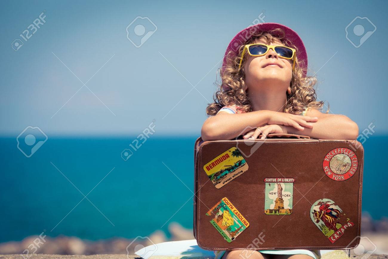 Child with vintage suitcase on summer vacation. Travel and adventure concept - 38259947 Child with vintage suitcase on summer vacation. Travel and adventure concept - 38259947