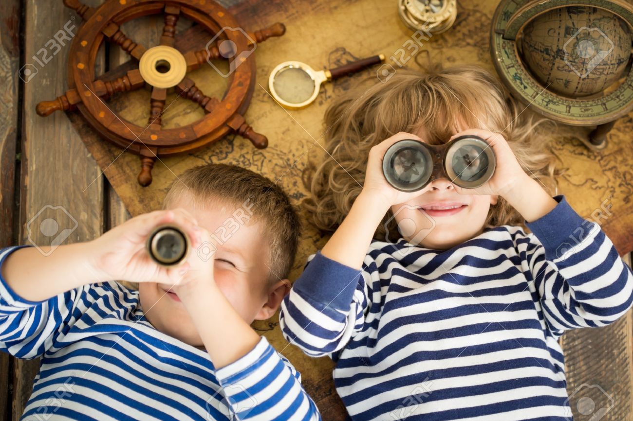 Happy kids playing with nautical things. Children having fun at home. Travel and adventure concept. Unusual high angle view portrait - 38974191 Happy kids playing with nautical things. Children having fun at home. Travel and adventure concept. Unusual high angle view portrait - 38974191