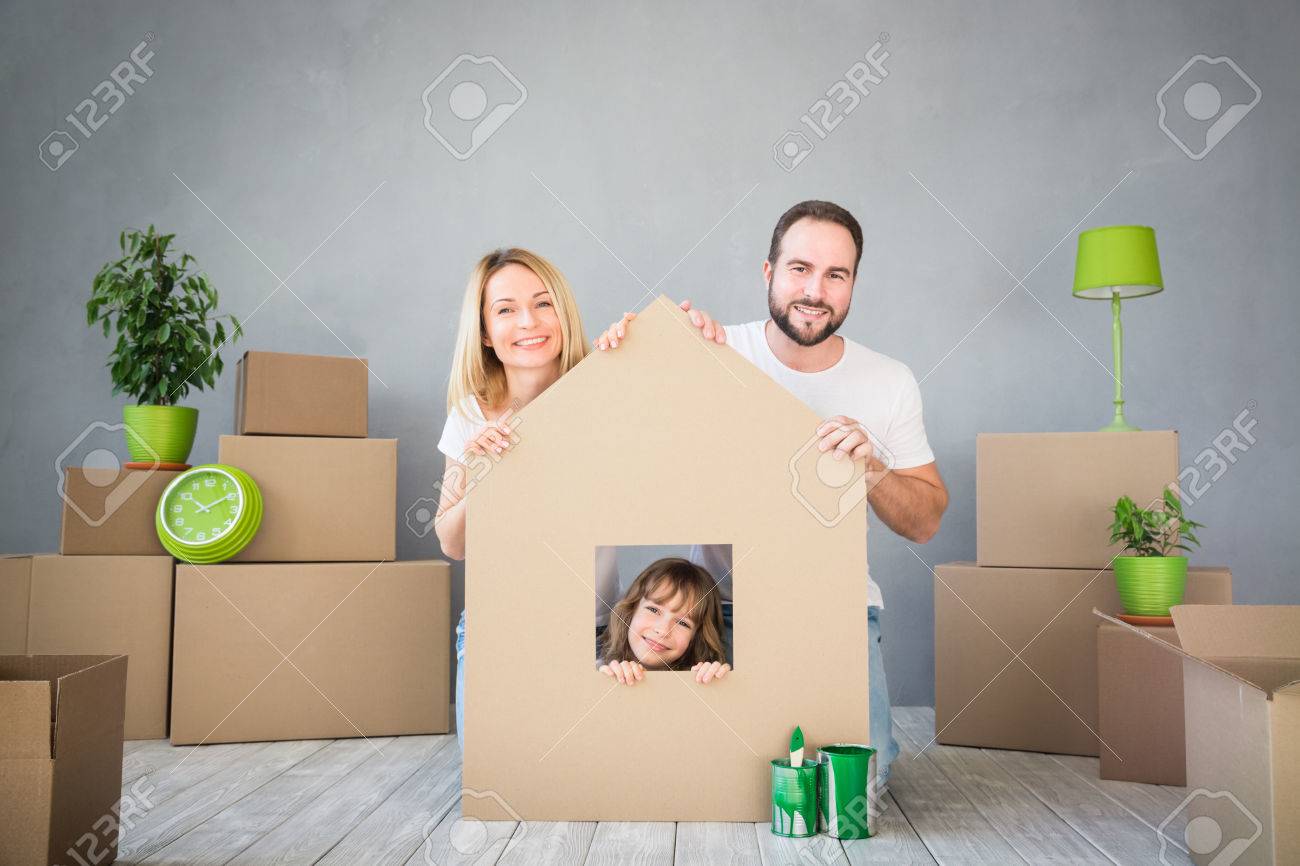 Happy family playing into new home. - 73219288 Happy family playing into new home. - 73219288