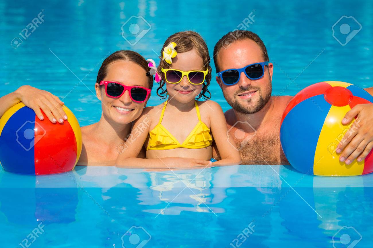 Happy family having fun on summer vacation. Father, mother and child playing in swimming pool. Active healthy lifestyle concept - 79035664 Happy family having fun on summer vacation. Father, mother and child playing in swimming pool. Active healthy lifestyle concept - 79035664