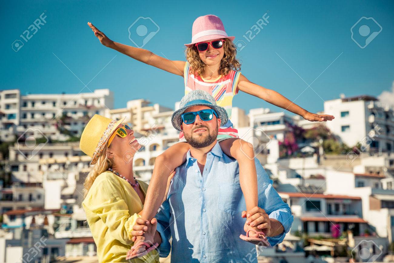 Happy family travelling. People having fun in old european town. Summer holiday and vacation concept - 80327392 Happy family travelling. People having fun in old european town. Summer holiday and vacation concept - 80327392
