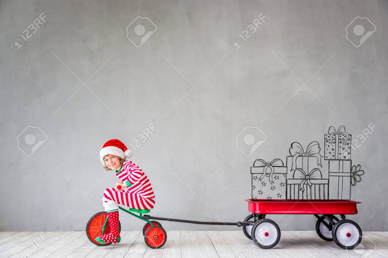 Happy child in Christmas time. Funny kid playing at home. Xmas winter holiday concept - 88269361 Happy child in Christmas time. Funny kid playing at home. Xmas winter holiday concept - 88269361