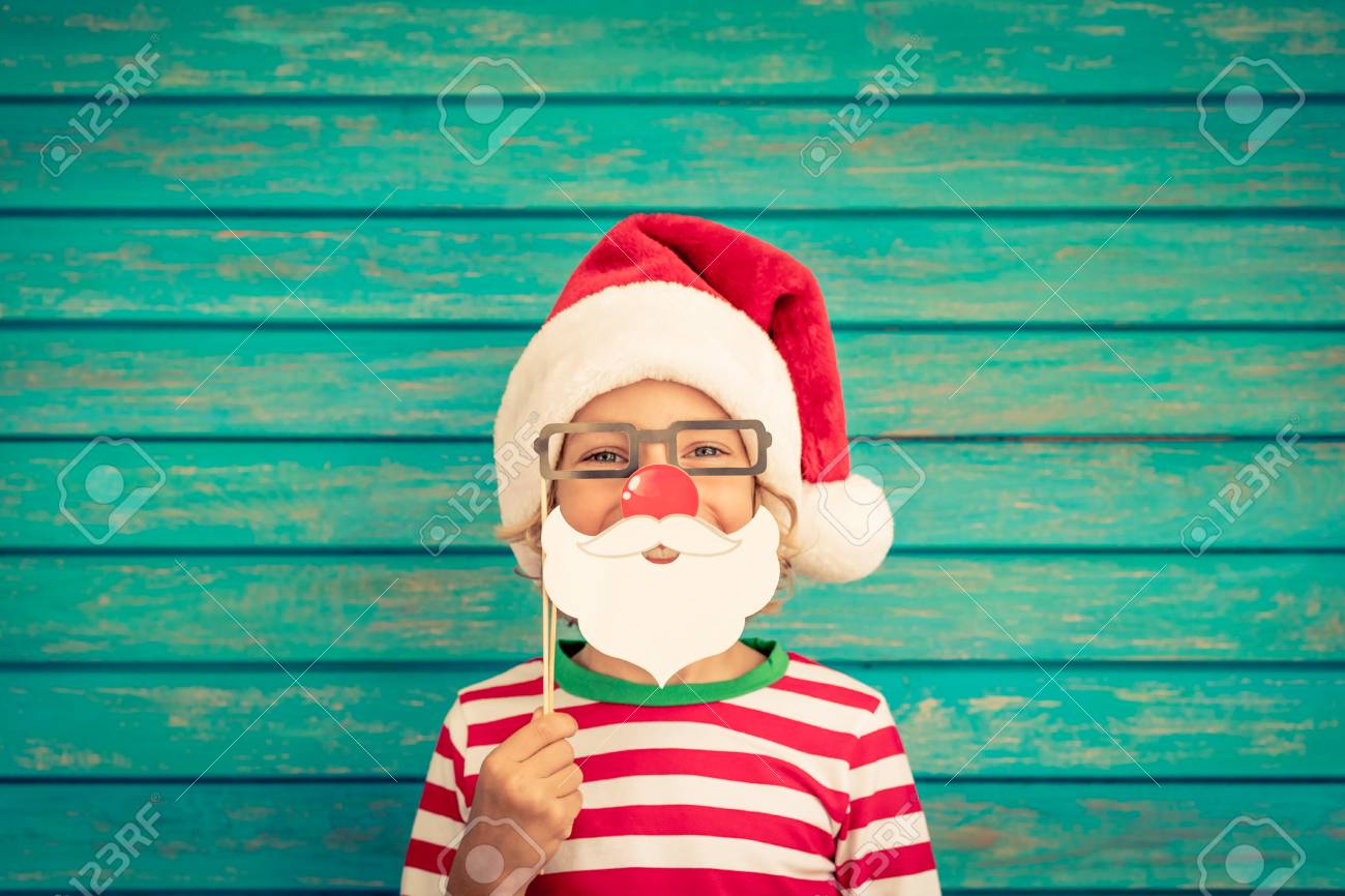 Happy child playing at home. Funny kid on Christmas eve. Xmas winter holiday concept - 89325357 Happy child playing at home. Funny kid on Christmas eve. Xmas winter holiday concept - 89325357
