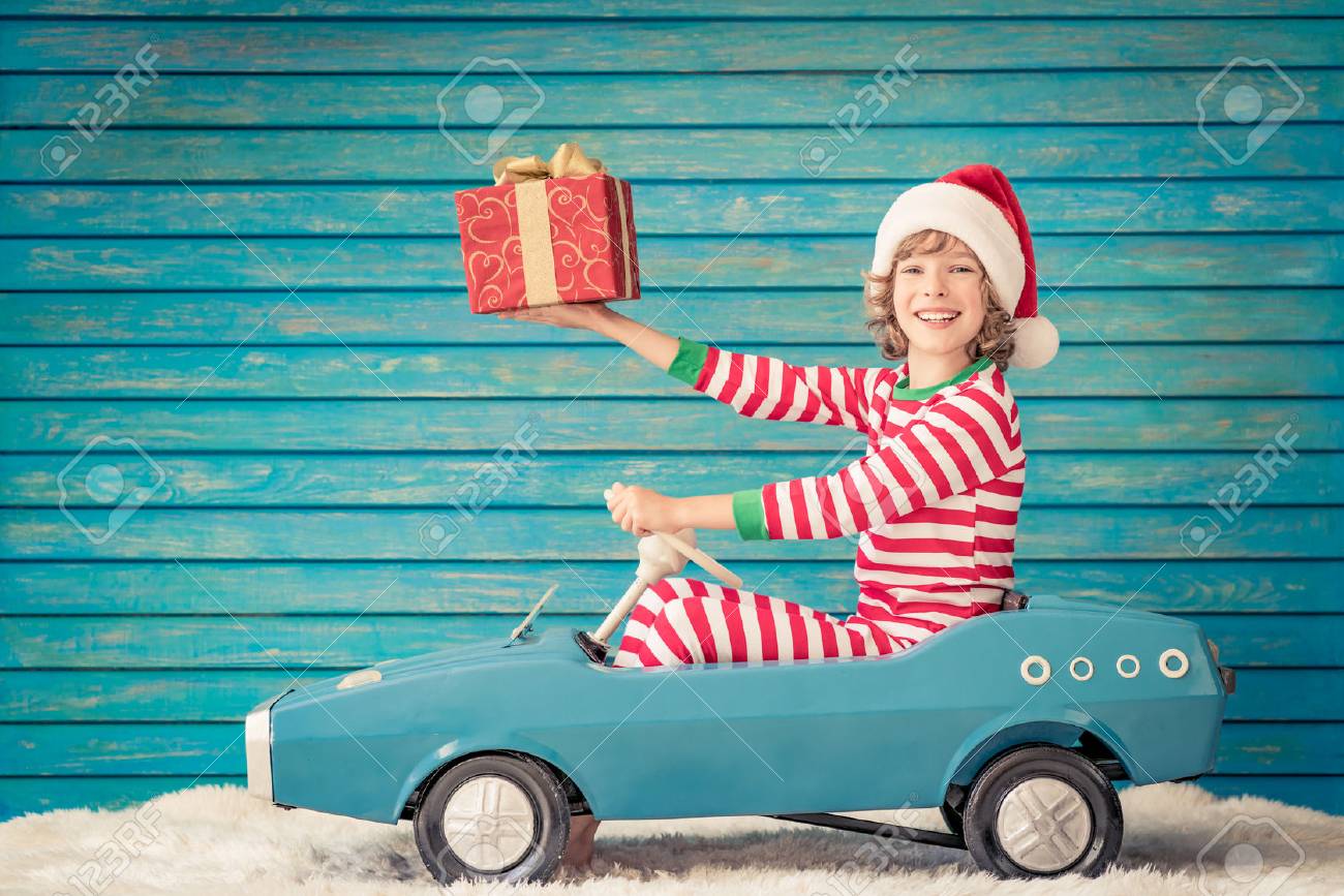 Happy child playing at home. Funny kid on Christmas eve. Xmas winter holiday concept - 89791683 Happy child playing at home. Funny kid on Christmas eve. Xmas winter holiday concept - 89791683