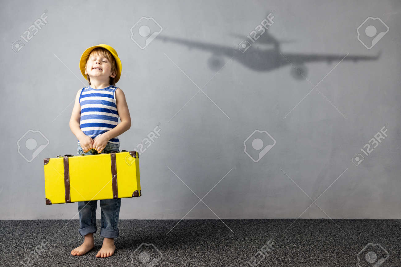 Happy child dreaming about travel. Summer vacation concept - 167649502 Happy child dreaming about travel. Summer vacation concept - 167649502