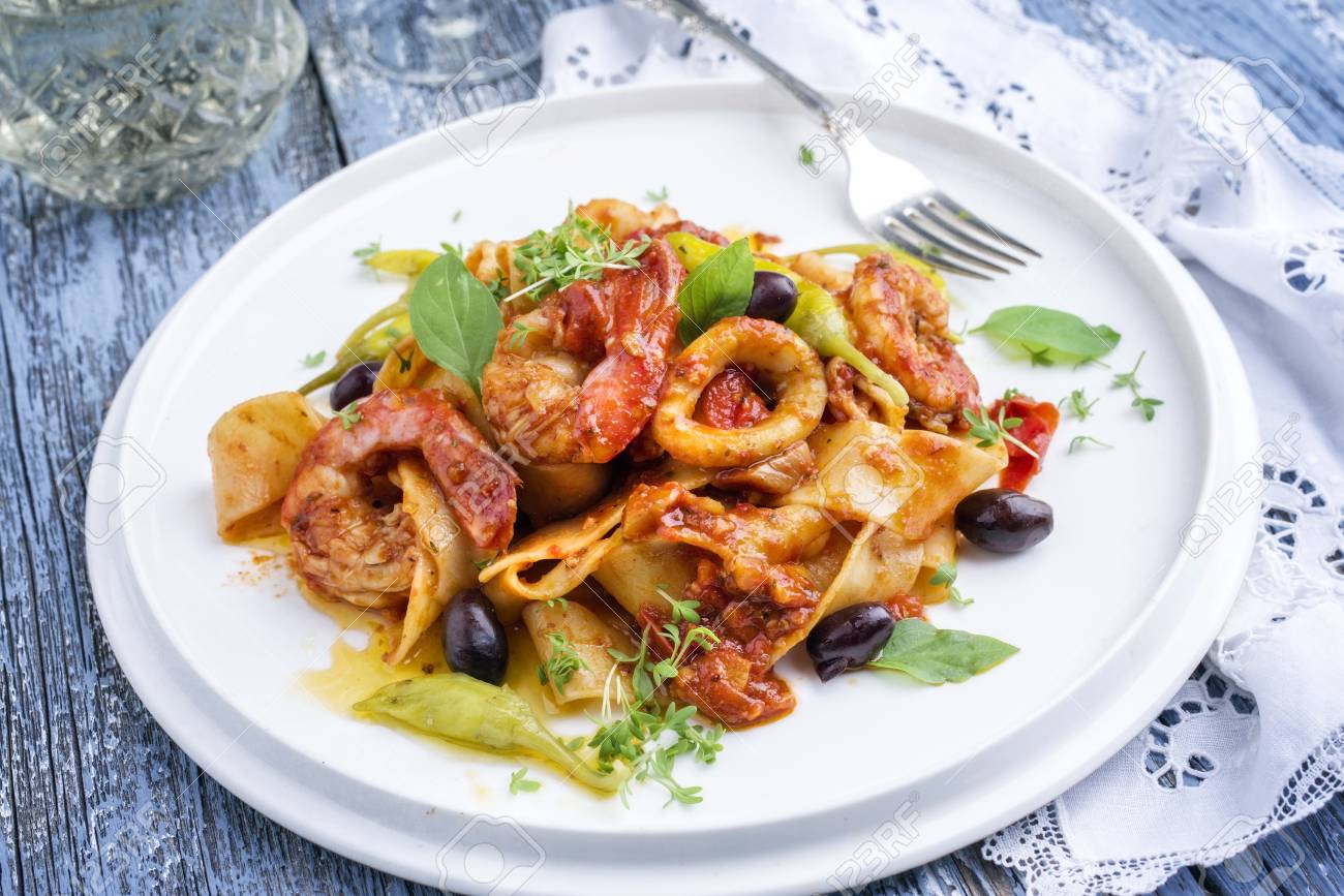 Italian Tagliatelle Con Gamberi E Calamari In Salsa Di Pomodoro Stock Photo Picture And Royalty Free Image Image 94523506