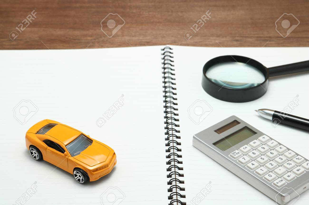 toy car magnifying glass calculator pen and notebook rent buy car calculator