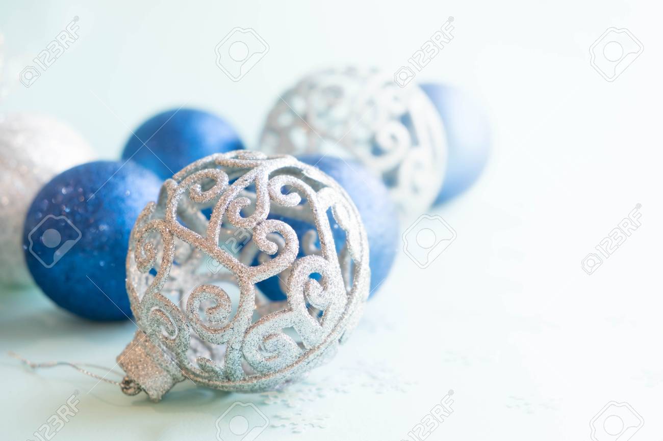 stock photo white christmas ornaments on light blue background with colorful bokeh lights merry christmas card winter holiday xmas theme - Light Blue Christmas Ornaments stock photo white christmas ornaments on light blue background with colorful bokeh lights merry christmas card winter holiday xmas theme - Light Blue Christmas Ornaments