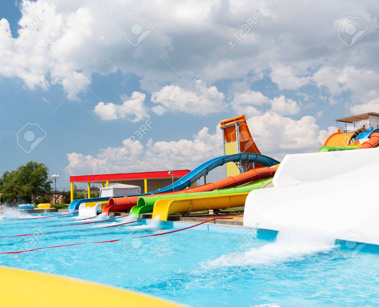 Outdoor water park. Multi-colored slides and pools. No people. - 136324643 Outdoor water park. Multi-colored slides and pools. No people. - 136324643