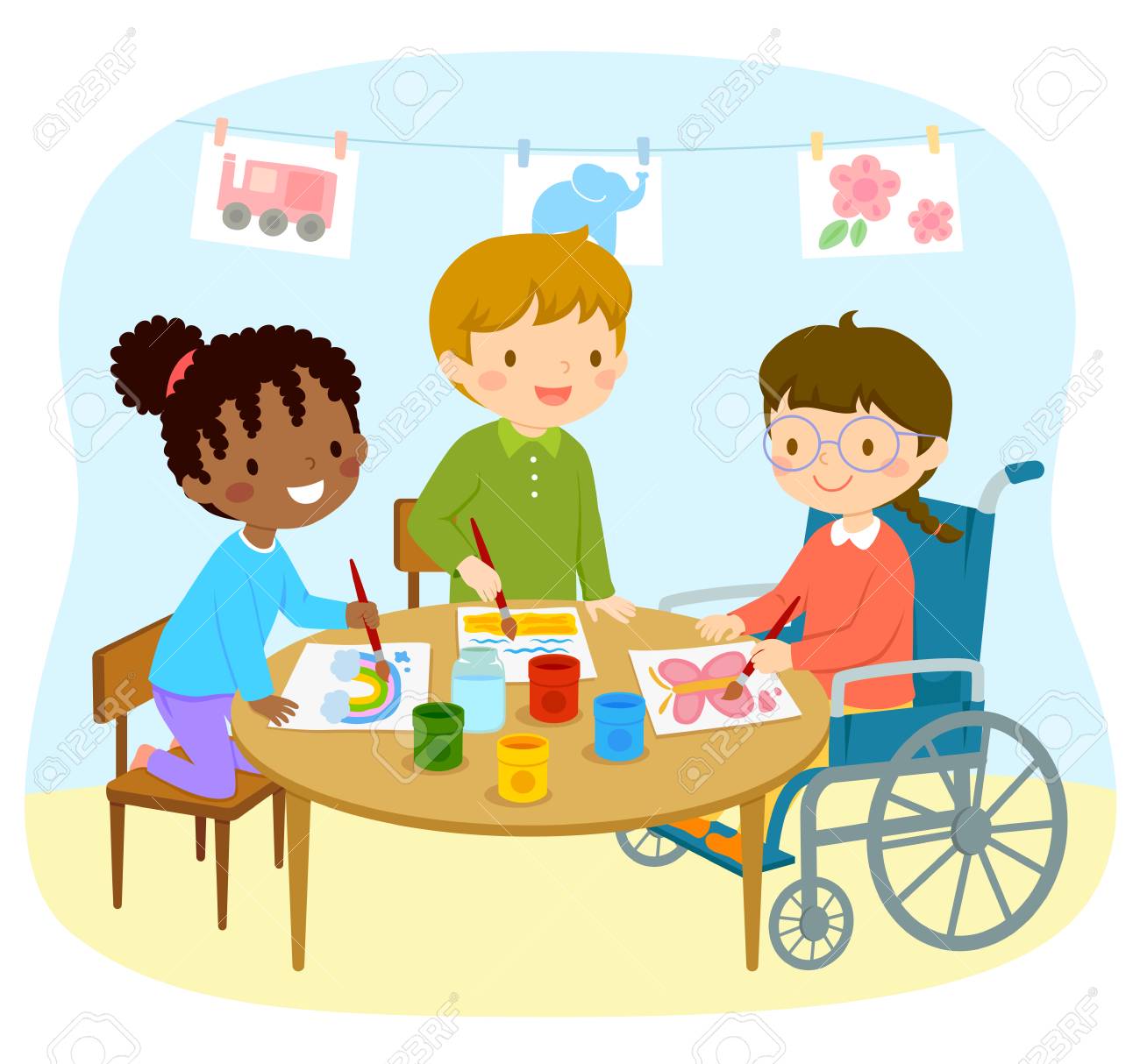 Disabled girl in a wheelchair drawing with her friends in the kindergarten - 118909474 Disabled girl in a wheelchair drawing with her friends in the kindergarten - 118909474