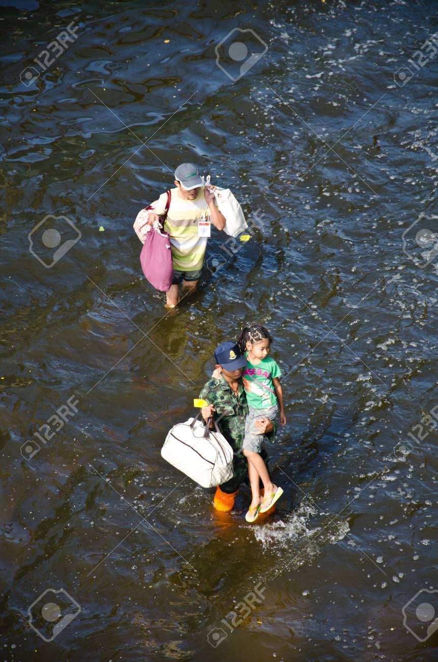 BANGKOK THAILAND – NOVEMBER 13 : the victims of flood waiting for higher vehicle in Phahon Yothin Road November 13, 2011 in Bangkok, Thailand. - 11215207 BANGKOK THAILAND – NOVEMBER 13 : the victims of flood waiting for higher vehicle in Phahon Yothin Road November 13, 2011 in Bangkok, Thailand. - 11215207