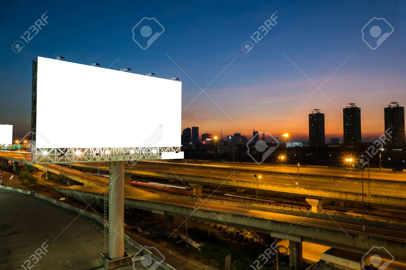 Advertising blank billboard on sidelines of expressway at twilight for advertisement. - 55395526 Advertising blank billboard on sidelines of expressway at twilight for advertisement. - 55395526