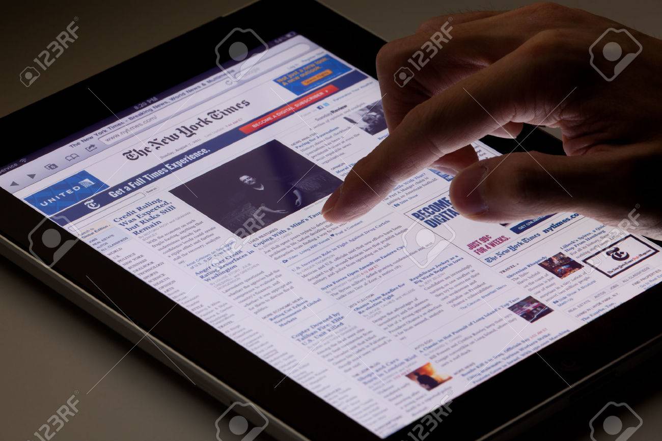 Hong Kong, China - August 7, 2011: Image of browsing the New York Times website using an ipad. The New York Times is a popular American daily newspaper and its website is the most popular American online newspaper website. - 42179369 Hong Kong, China - August 7, 2011: Image of browsing the New York Times website using an ipad. The New York Times is a popular American daily newspaper and its website is the most popular American online newspaper website. - 42179369