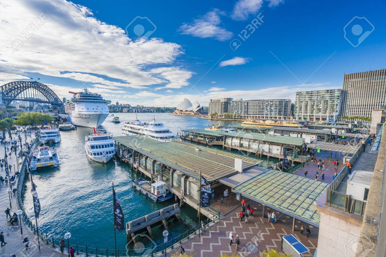 Sydney, Australia - June 23, 2016: People visiting Circular Quay in Sydney CBD, with view of Harbour Bridge and Opera House - 60270388 Sydney, Australia - June 23, 2016: People visiting Circular Quay in Sydney CBD, with view of Harbour Bridge and Opera House - 60270388
