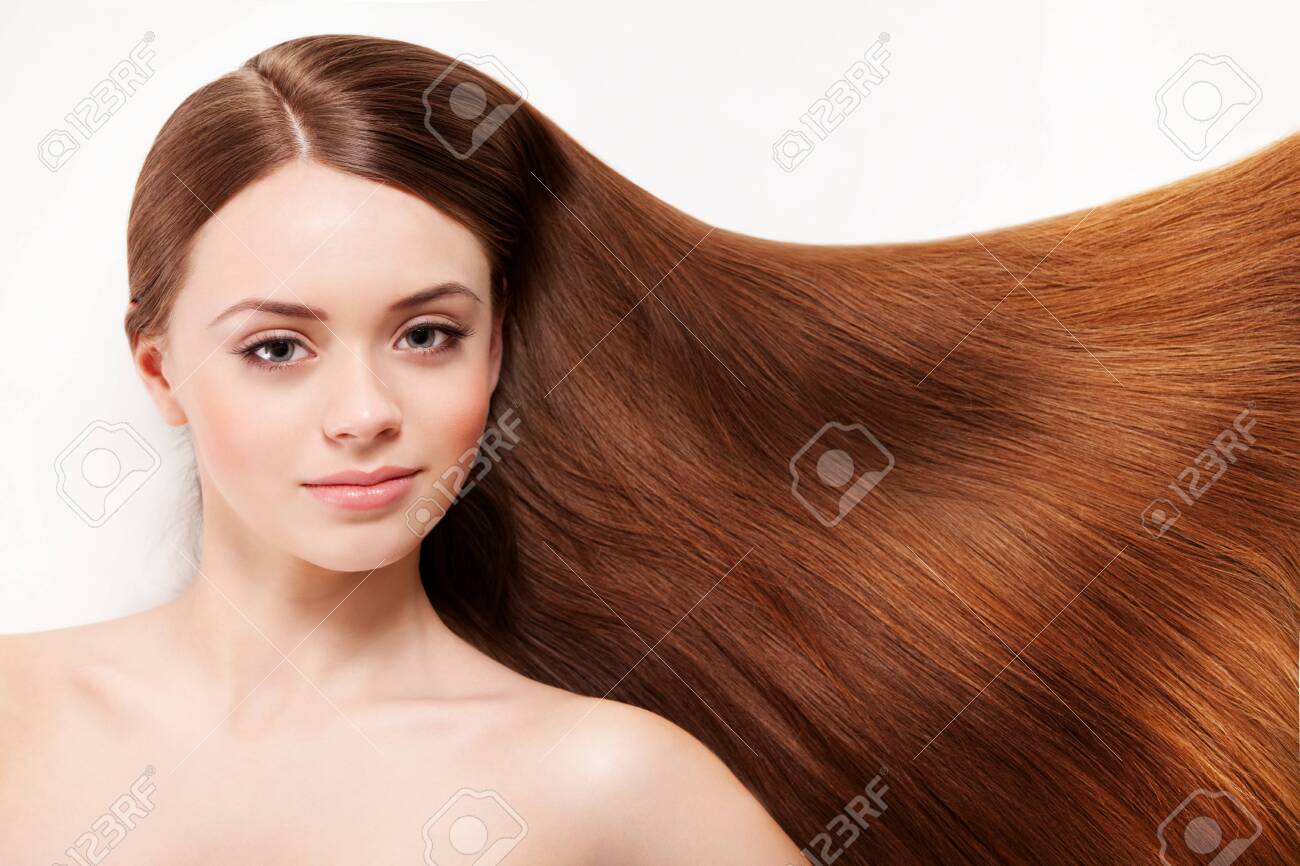 Beautiful woman with her long brown hair - 139823517 Beautiful woman with her long brown hair - 139823517