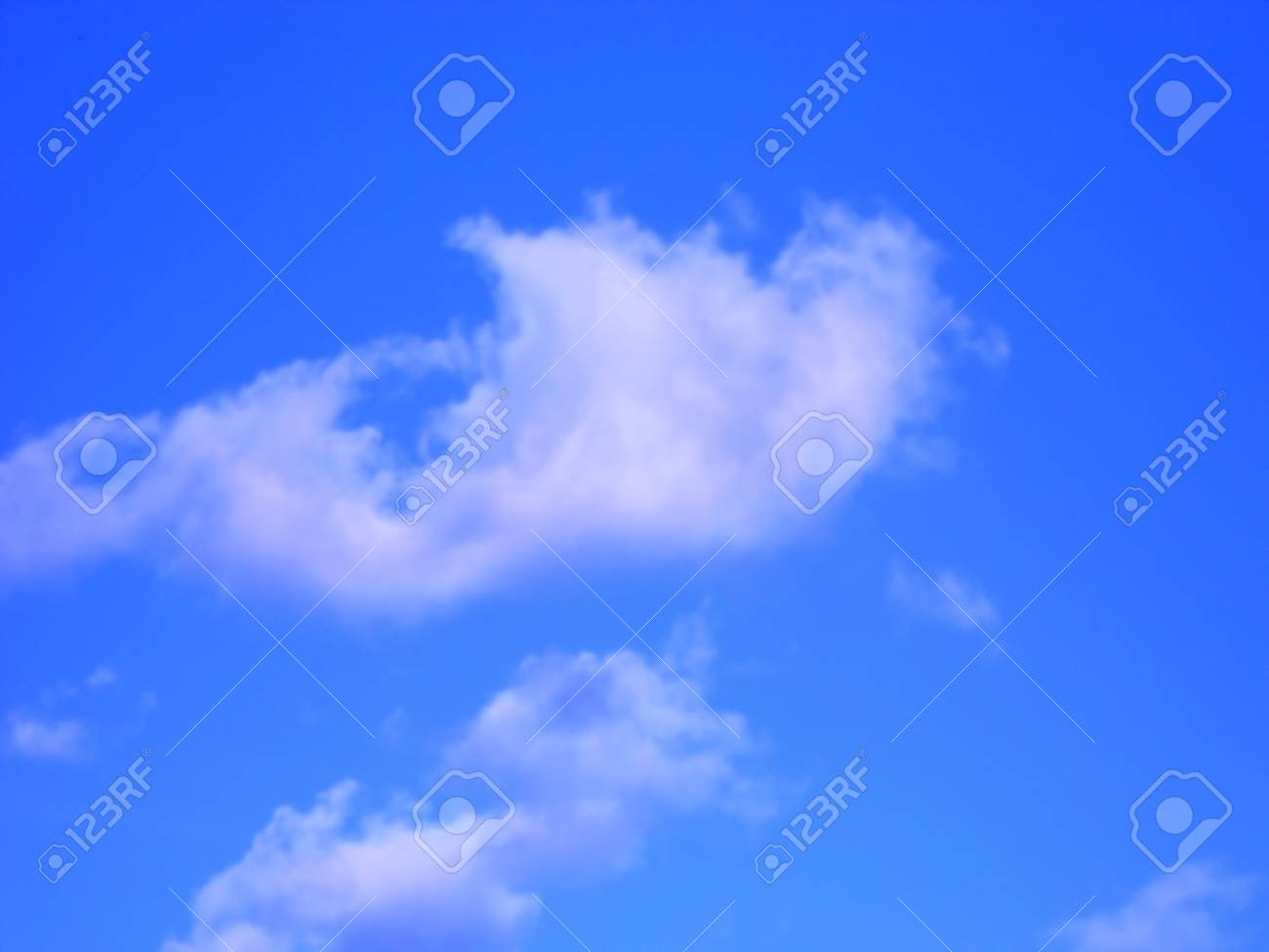 Clouds Floating On The Dark Blue Sky Stock Photo Picture And