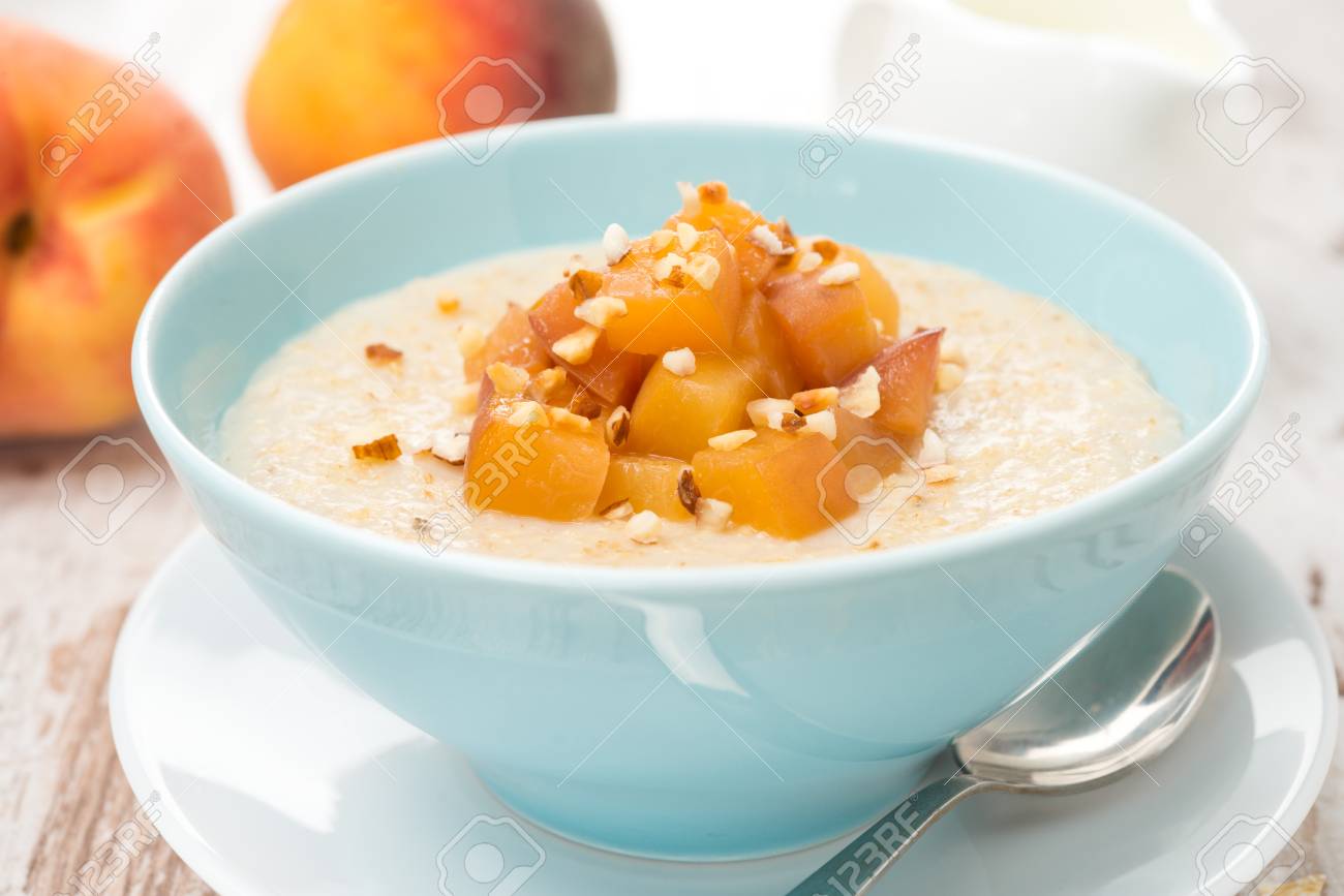 oatmeal with caramelized peaches in a bowl and jug of yogurt for breakfast, close-up, horizontal - 23248563 oatmeal with caramelized peaches in a bowl and jug of yogurt for breakfast, close-up, horizontal - 23248563