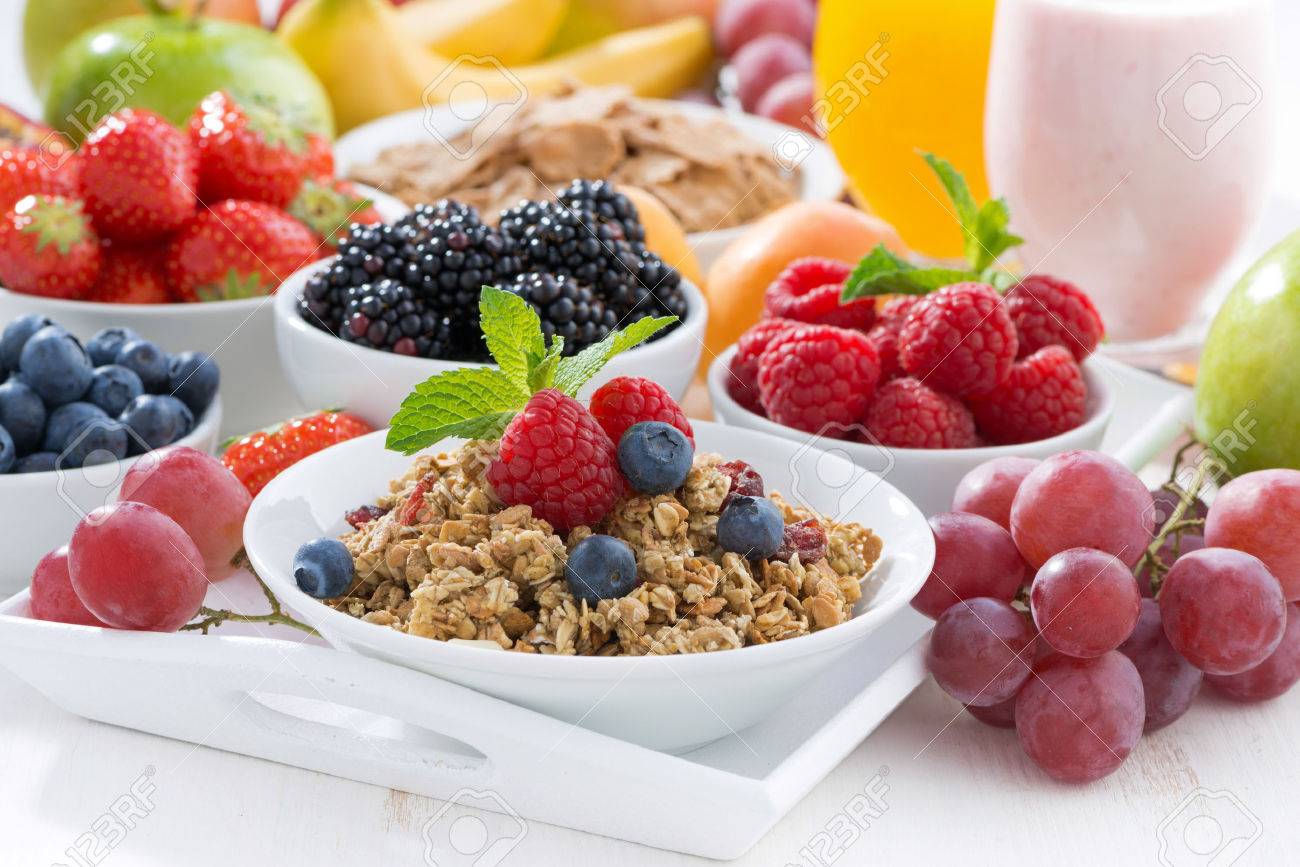 Delicious and healthy breakfast with fruits, berries and cereal, horizontal - 42441498 Delicious and healthy breakfast with fruits, berries and cereal, horizontal - 42441498