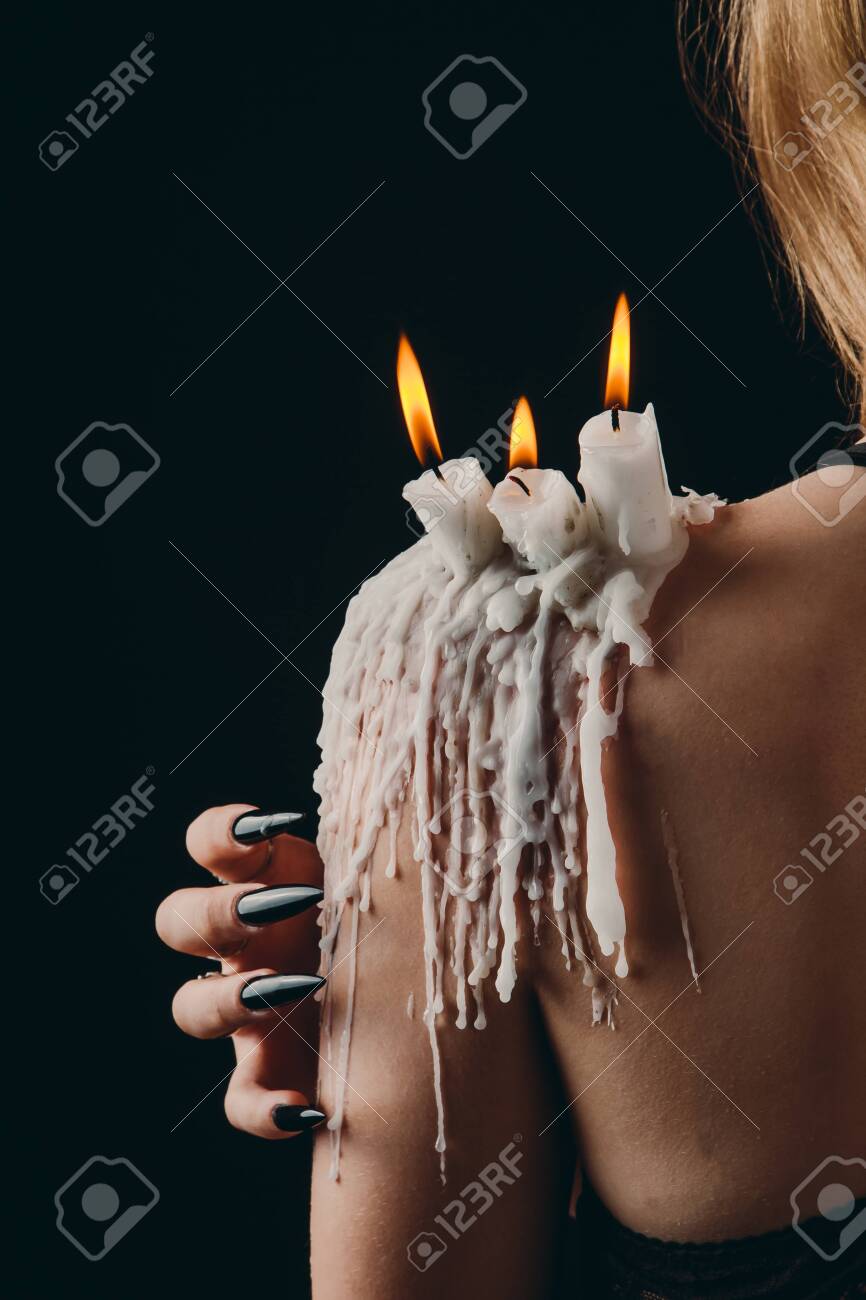 A Girl With Long Hair In The Image Of A Witch Is Trying To Set