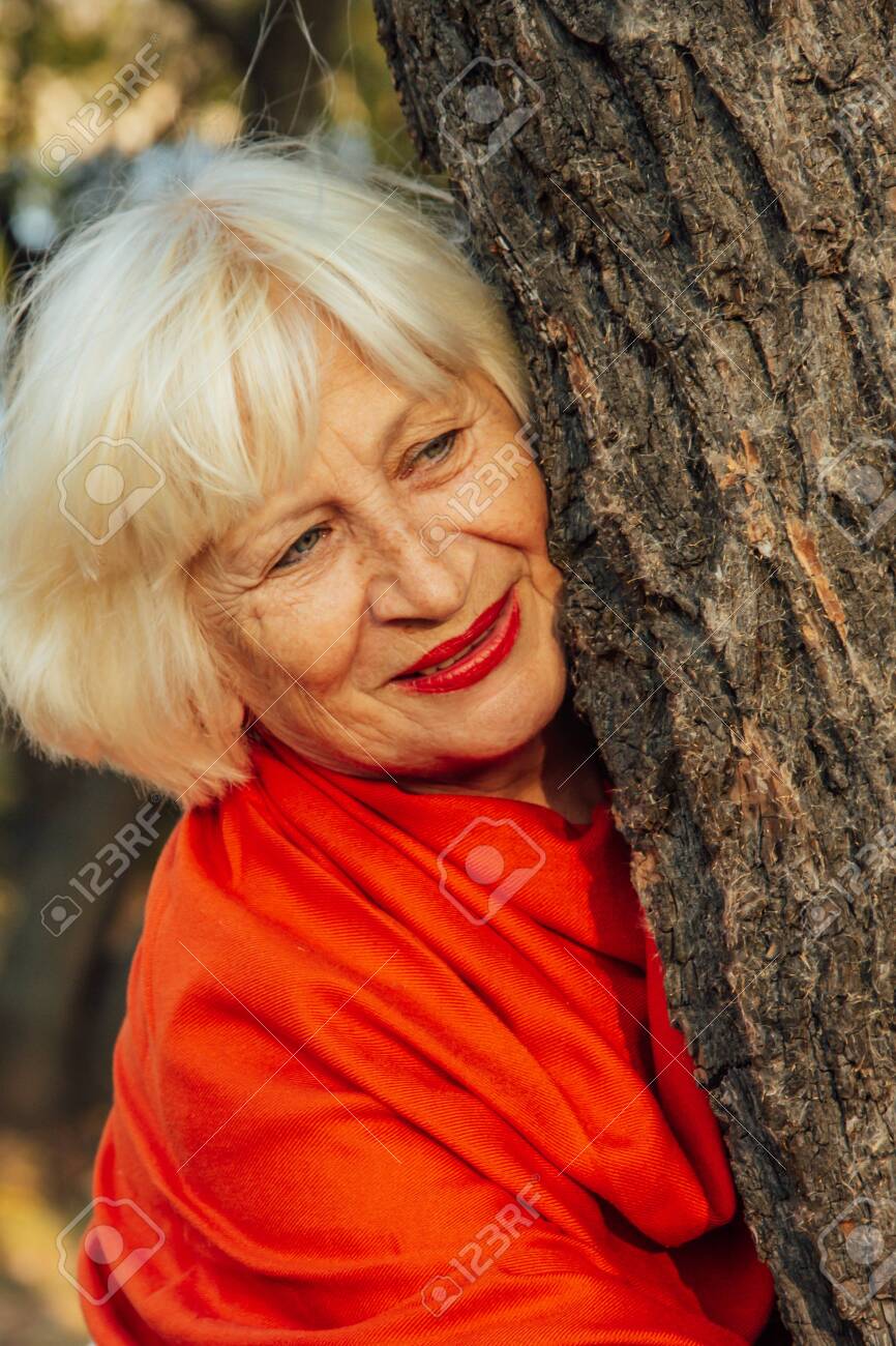 photo Anniversary Old Couple Photography old couple is walking in the green park fifty years together stock photo picture and royalty free image image 136298037