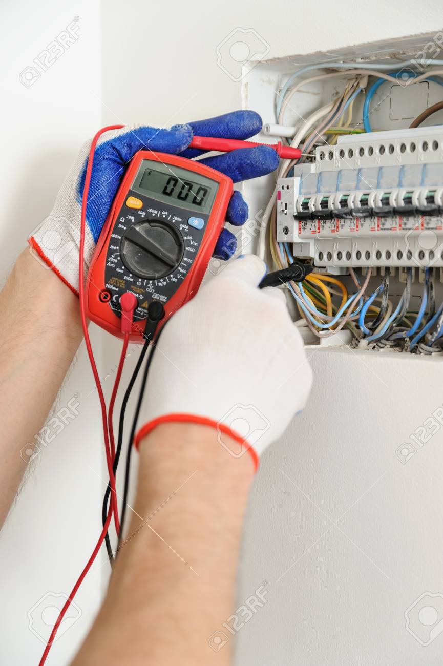 https://previews.123rf.com/images/yunava1/yunava11610/yunava1161000019/66206720-electrician-check-voltage-in-electrical-fuse-box-with-a-multimeter.jpg