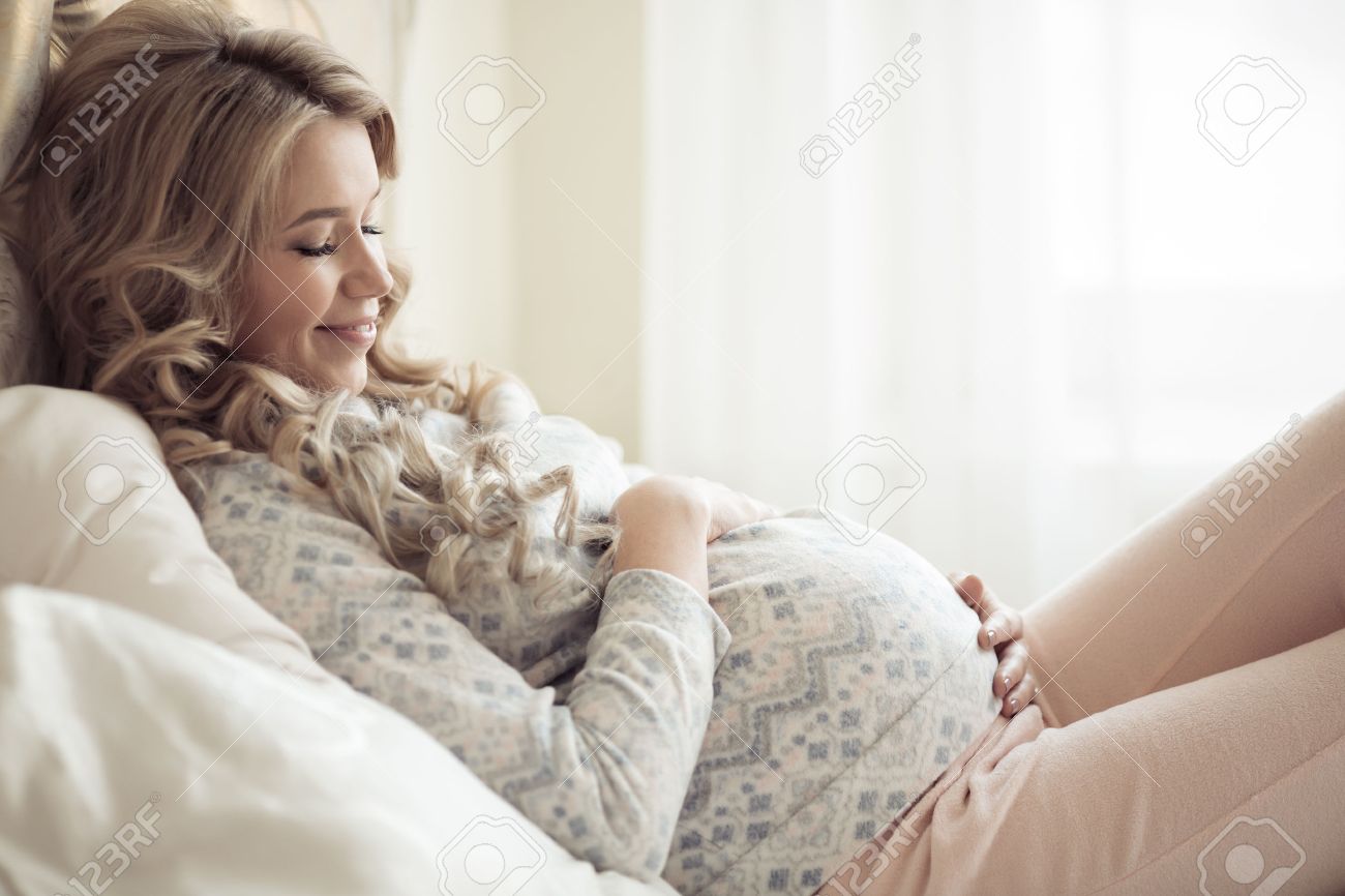 Beautiful Pregnant Woman In Cozy Clothes. - 64800624 Beautiful Pregnant Woman In Cozy Clothes. - 64800624