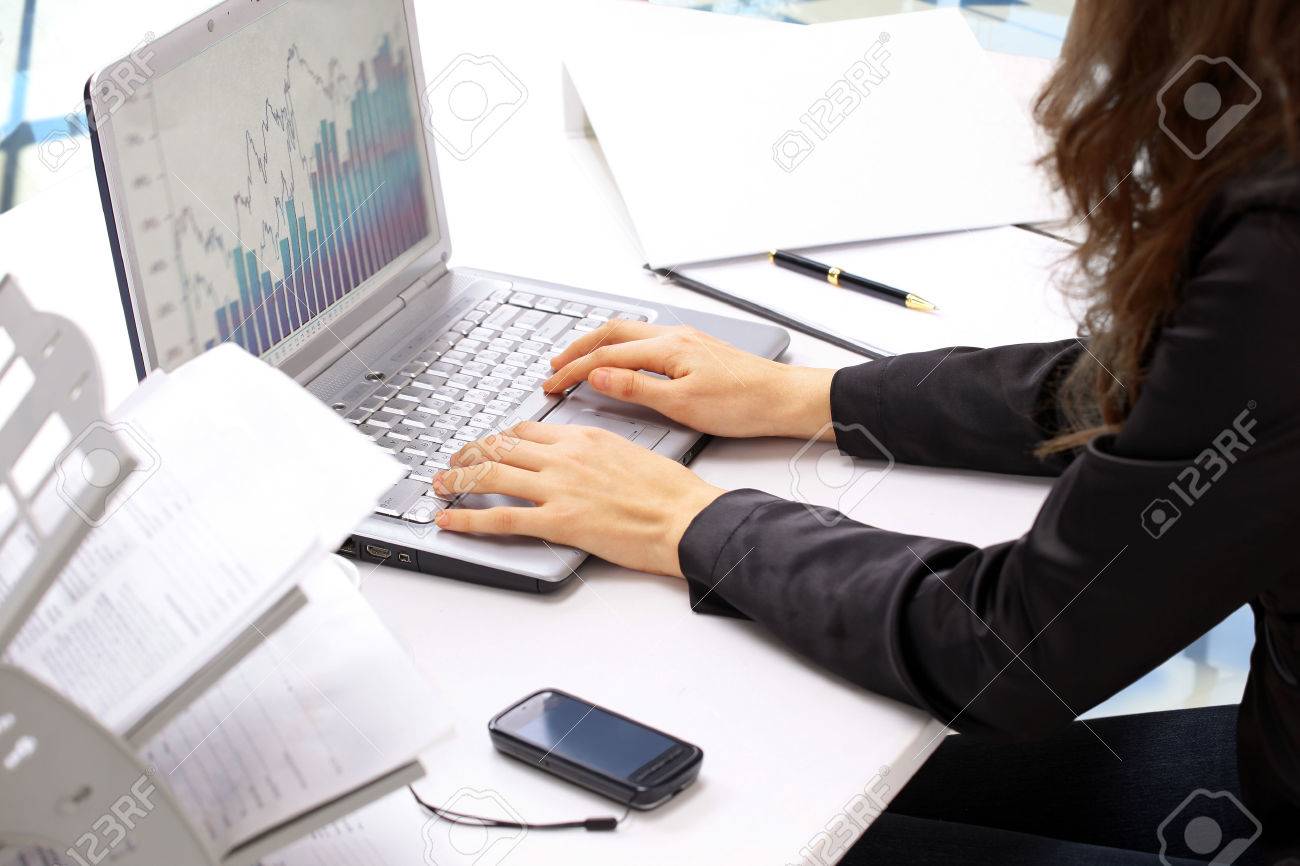 Female hands typing on the keyboard and while holding the mouse. Analysis of the graphs of sales. - 37580537 Female hands typing on the keyboard and while holding the mouse. Analysis of the graphs of sales. - 37580537
