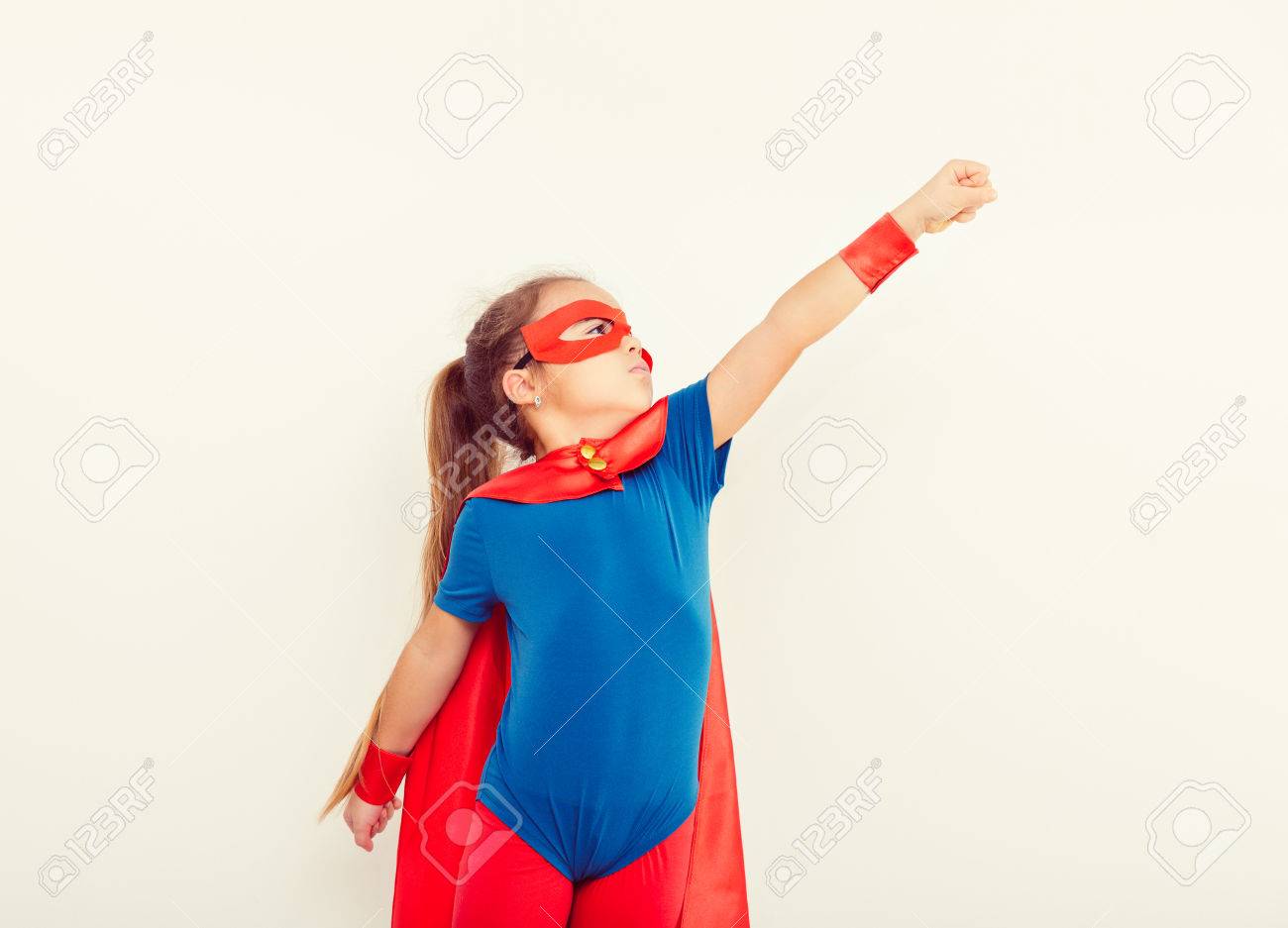 Funny Little Power Super Hero Child Girl In A Blue Raincoat Superhero Concept Stock Photo Picture And Royalty Free Image Image