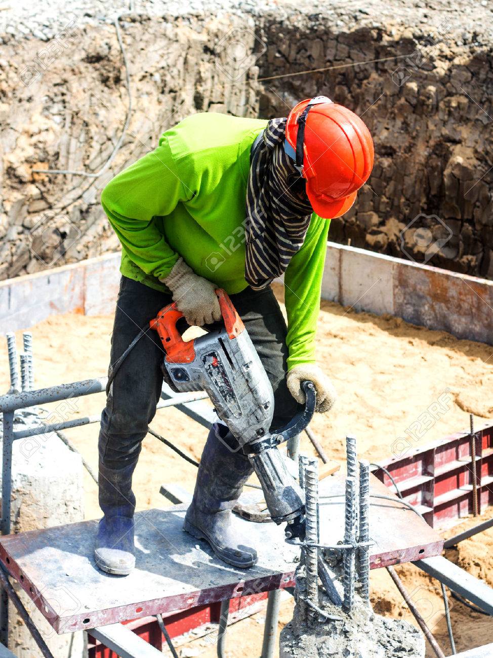 Portarait Of Positive Builder Worker With Pneumatic Hammer Drill Equipment At Construction Site Stock Photo, Picture and Royalty Free Image. Image 33795212.