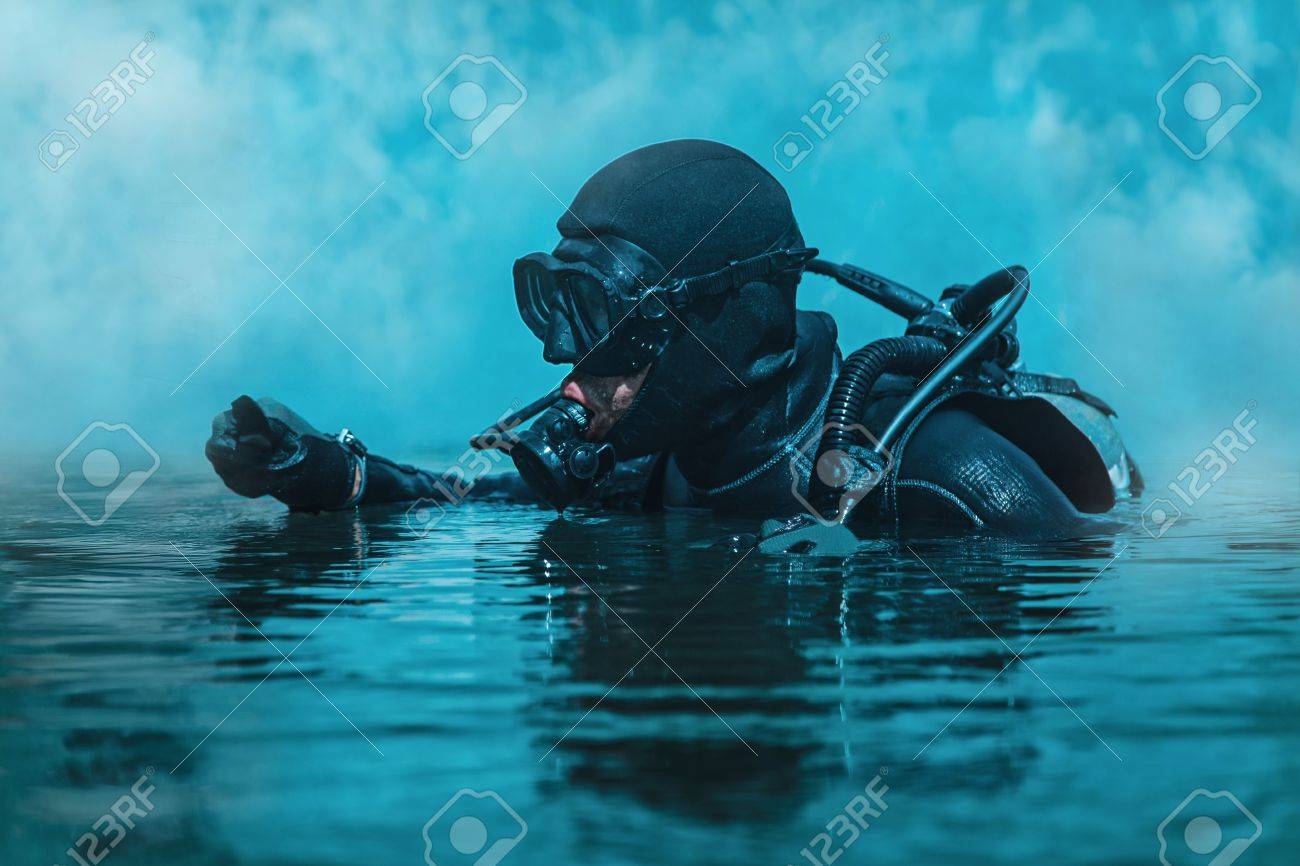 Navy SEAL frogman with complete diving gear and weapons in the water - 70000932 Navy SEAL frogman with complete diving gear and weapons in the water - 70000932